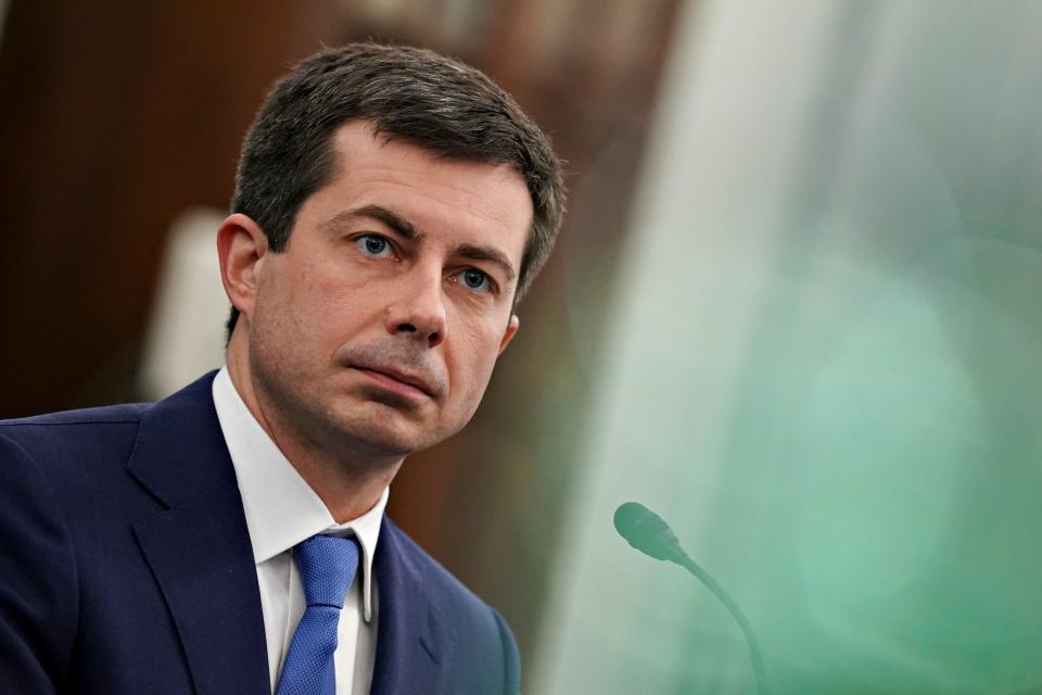 Pete Buttigieg was confirmed as Transportation Secretary Tuesday as the first openly gay Cabinet secretary to be confirmed by the Senate. Seen here, Pete Buttigieg takes part in a Senate Commerce, Science and Transportation Committee confirmation hearing on Capitol Hill, Jan. 21, 2021, in Washington.