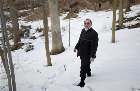 Historian Frank Watson descendS a snowy slope to the site of Duffy's Cut in Malvern, Pennsylvania March 8, 2014. REUTERS/Mark Makela