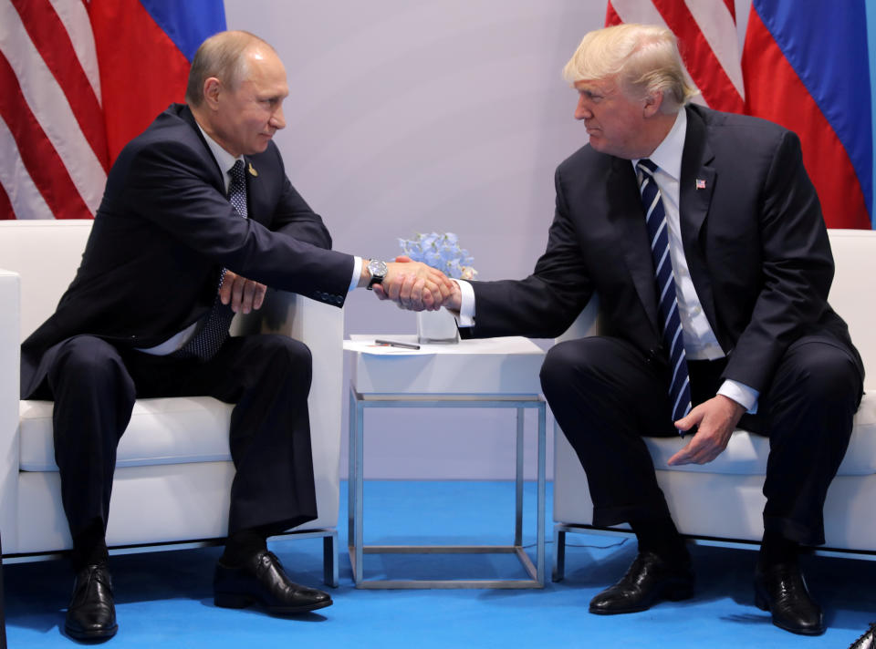 President Trump shakes hands with Russia’s President Vladimir Putin during their bilateral meeting at the G-20 summit in Hamburg, Germany, in July 2017. (Carlos Barria/Reuters)