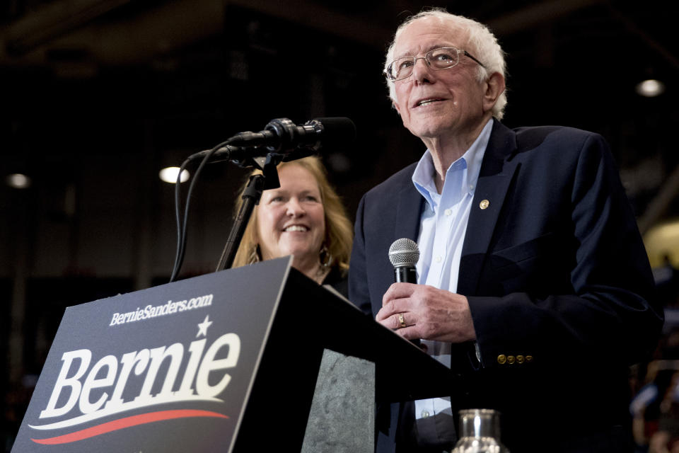 Democratic presidential candidate Sen. Bernie Sanders, I-Vt., stands on stage with his wife Jane Sanders, left, after speaking at a campaign stop at the Whittemore Center Arena at the University of New Hampshire, Monday, Feb. 10, 2020, in Durham, N.H. (AP Photo/Andrew Harnik)