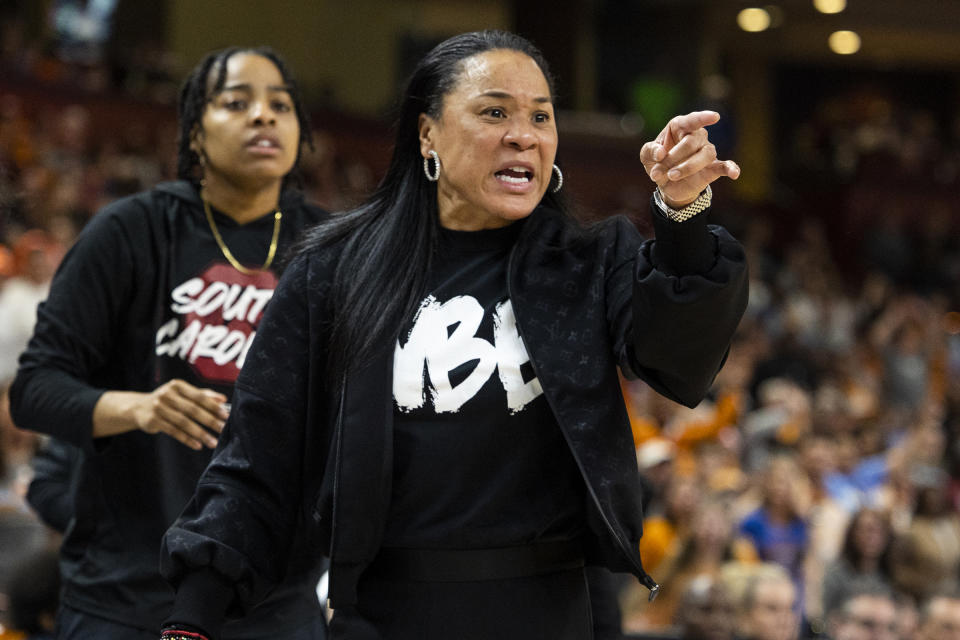 FILE - South Carolina's coach Dawn Staley argues a call during their game against Tennessee in the second half of the championship game of the Southeastern Conference women's tournament in Greenville, S.C., Sunday, March 5, 2023. South Carolina 6-foot-7 center Kamilla Cardoso has been content the past two seasons playing in the shadow of All-American teammate Aliyah Boston. Now, Cardoso must step into the spotlight and be as dominant as Boston if the Gamecocks hope to continue contending for championships. It's a role Cardoso's coach Dawn Staley, her teammates and others say she's been building toward the past few years. (AP Photo/Mic Smith, FIle)