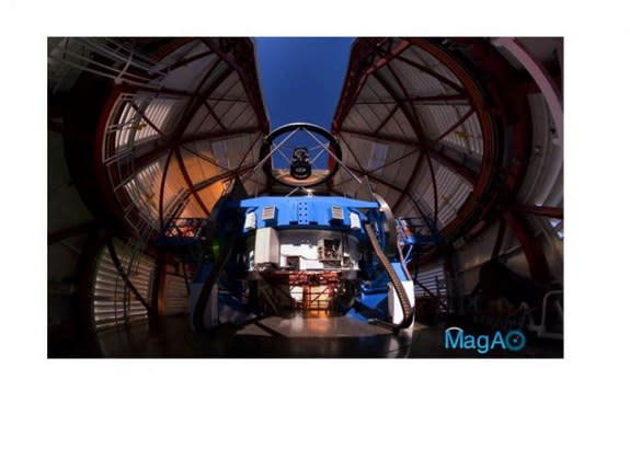 The Magellan Telescope with MagAO’s Adaptive Secondary Mirror (ASM) mounted at the top looking down some 30 feet onto the 21-foot diameter primary mirror, which is encased inside the blue mirror cell. Image released Aug. 20, 2013.