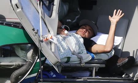 Injured Brazilian national soccer team player Neymar waits to be airlifted home from Brazil's training camp inTeresopolis, near Rio de Janeiro, July 5, 2014. REUTERS/Marcelo Regua