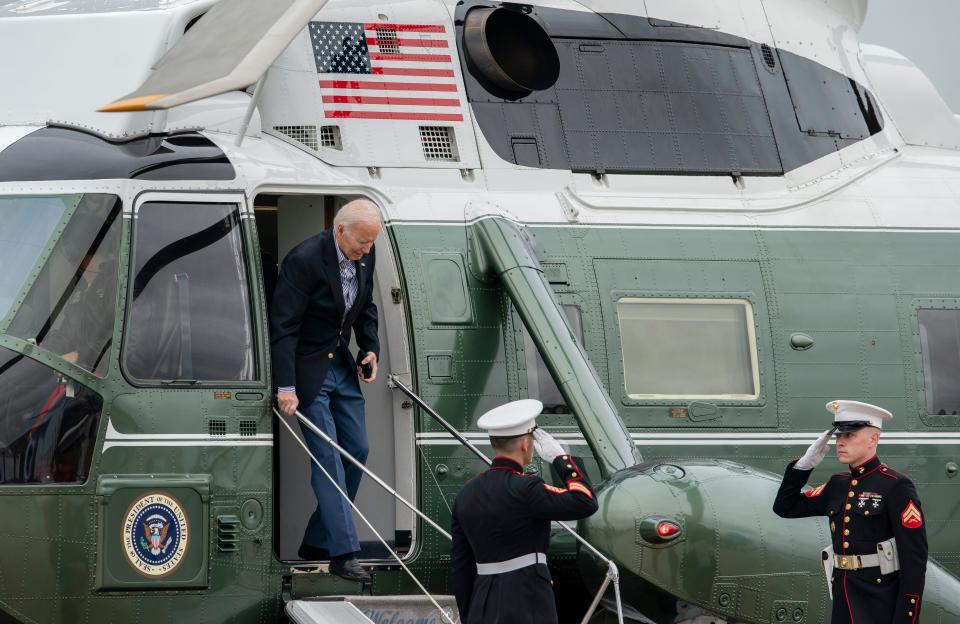 President Joe Biden exits Marine One to board Air Force One for a trip to Florida to visit areas impacted by Hurricane Ian, Wednesday, Oct. 5, 2022, at Andrews Air Force Base, Md. (AP Photo/Gemunu Amarasinghe)