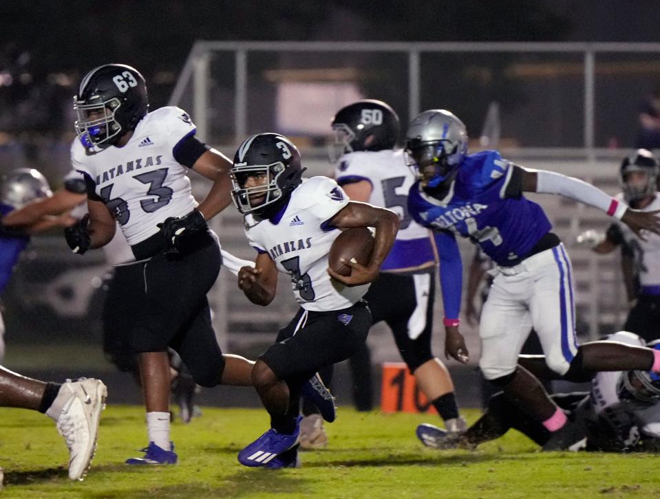 Matanzas QB Dakwon Evans (3) looks for running room during a game with Deltona at Deltona High School, Monday, Oct. 2, 2023.