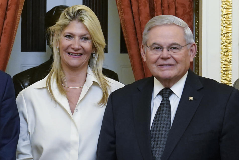 FILE - Senate Foreign Relations Committee Chairman, Sen. Bob Menendez, D-N.J., right, and his wife Nadine Arslanian, pose for a photo on Capitol Hill in Washington, Dec. 20, 2022. U.S. Sen. Bob Menendez of New Jersey and his wife have been indicted on charges of bribery. Federal prosecutors on Friday announced the charges against the 69-year-old Democrat nearly six years after an earlier criminal case against him ended with a deadlocked jury. (AP Photo/Susan Walsh, File)