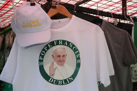 Pope Francis souvenirs are seen for sale in Dublin, Ireland August 23, 2018. REUTERS/Hannah McKay