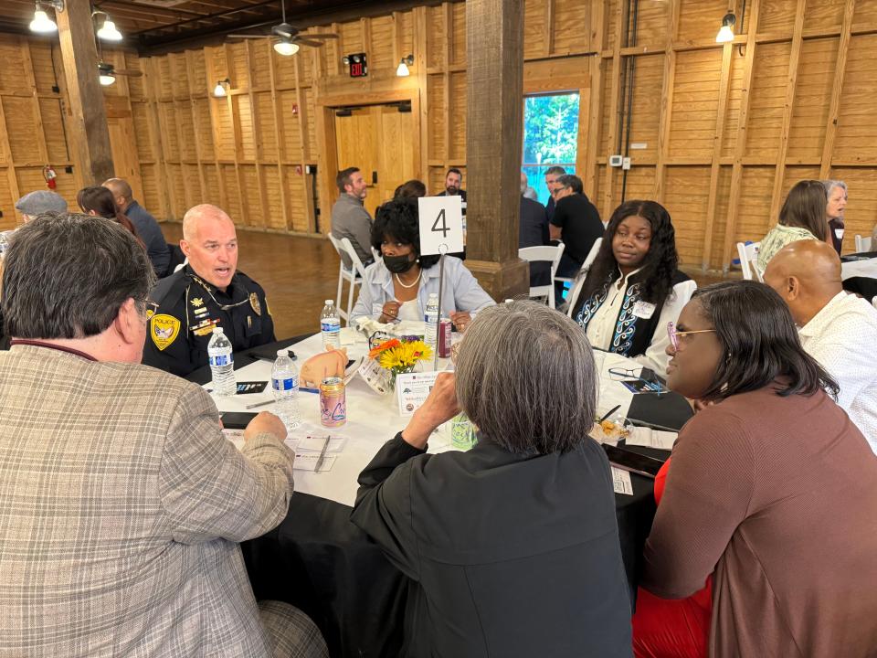 Tallahassee Police Chief Lawrence Revell sits and listens to guests at the Village Square Tallahassee's Speed Date with Local Leaders event on April 3.