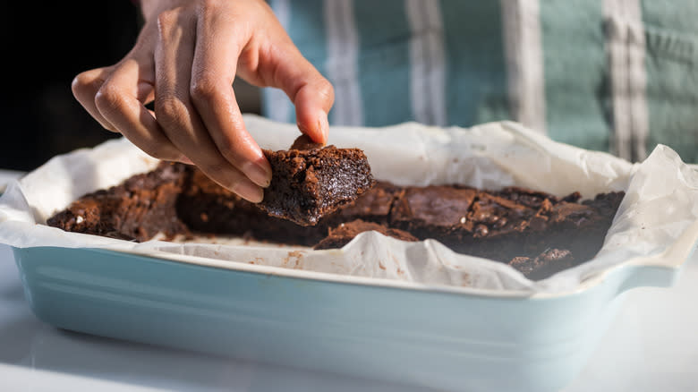 taking brownie out of pan