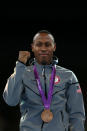 Bronze medalist <a href="http://sports.yahoo.com/olympics/taekwondo/terrence-jennings-1132211/" data-ylk="slk:Terrence Jennings;elm:context_link;itc:0;sec:content-canvas" class="link ">Terrence Jennings</a> of the United States celebrates on the podium during the medal ceremony for the Men's-68kg Taekwondo on Day 13 of the London 2012 Olympic Games at ExCeL on August 9, 2012 in London, England. (Getty Images)
