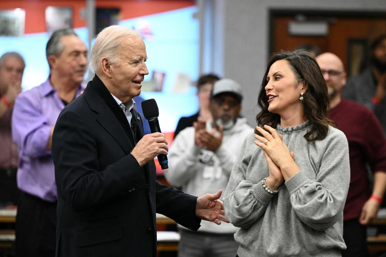 President Joe Biden speaks alongside Michigan Governor Gretchen Whitmer during a visit to a United Auto Workers (UAW) phone bank in Warren on Feb. 1, 2024.