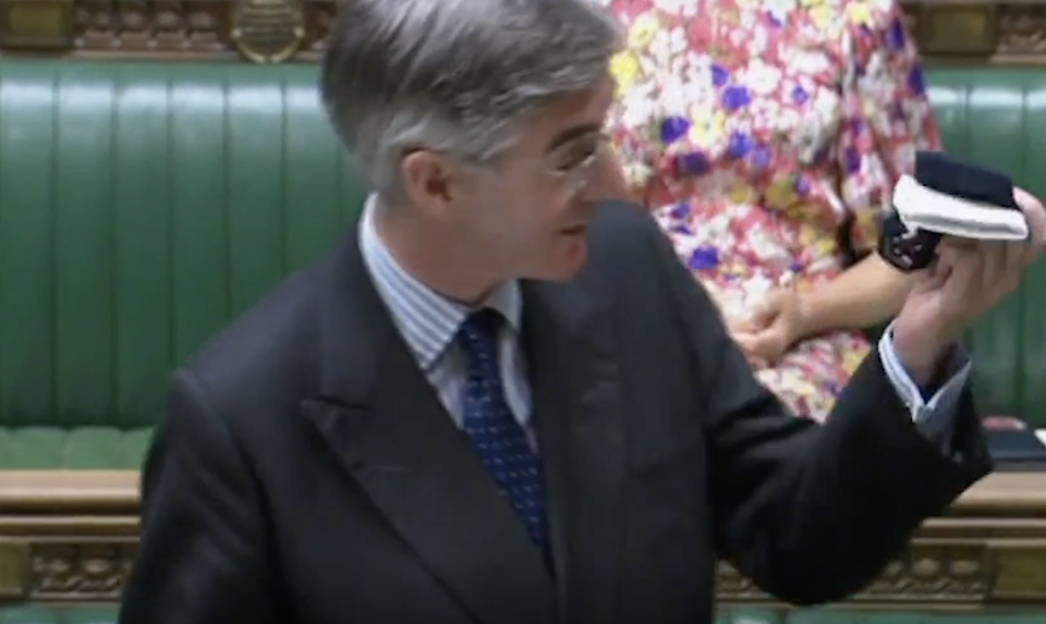 Jacob Rees-Mogg waves his unworn face mask in the House of Commons on Thursday. (Parliamentlive.tv)