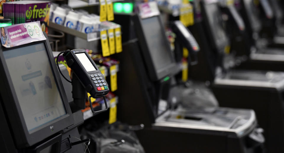 Woolworths checkouts pictured.