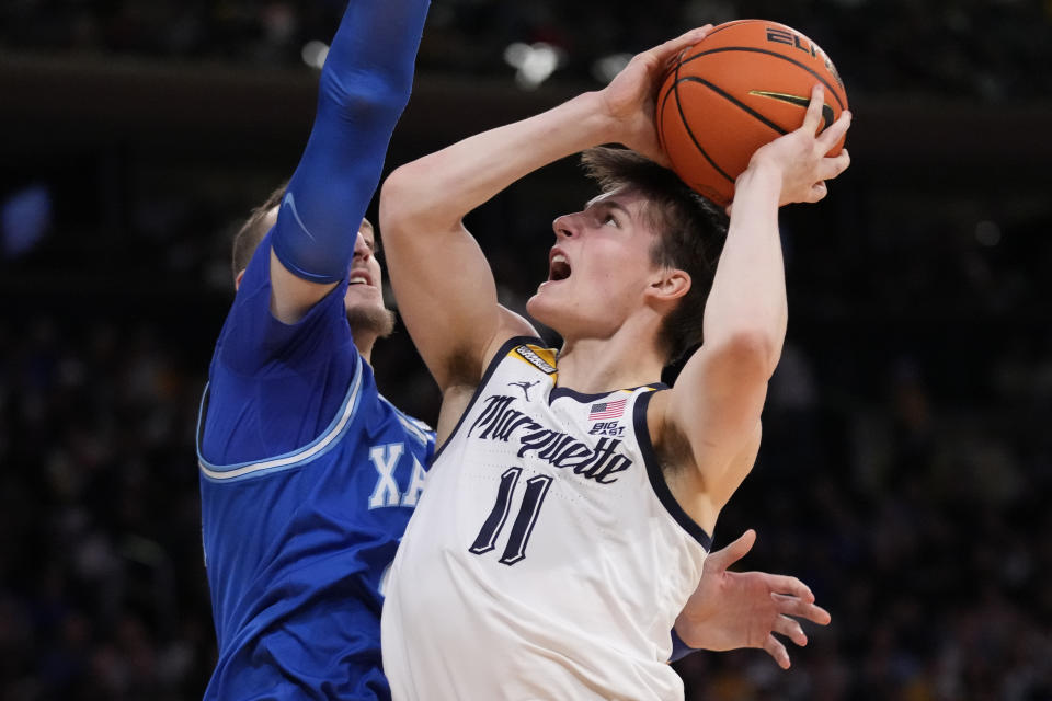 Marquette's Tyler Kolek (11) shoots against Xavier's Jack Nunge (24) in the first half of an NCAA college basketball game for the championship of the Big East men's tournament, Saturday, March 11, 2023, in New York. (AP Photo/John Minchillo)