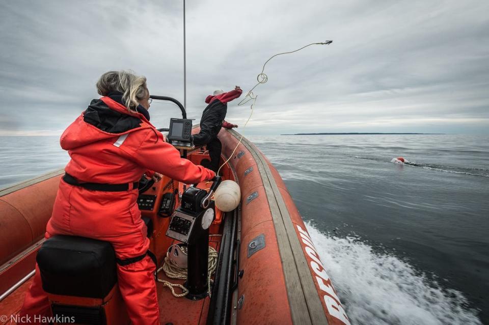 Photographer Nick Hawkins captured Moira Brown, left, and Mackie Green demonstrating their techniques for rescuing whales that have become entangled in fishing gear. The duo are part of the Campobello Whale Rescue Team.