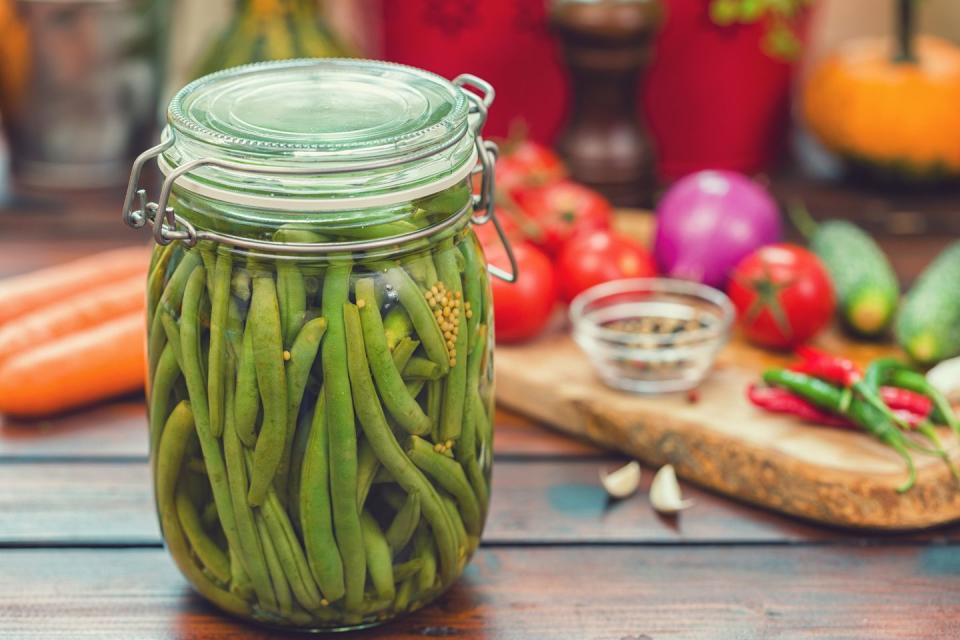 summer activities preserving green beans in a jar