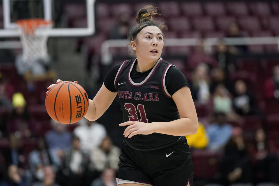 Santa Clara guard Ashley Hiraki (31) brings the ball up against Stanford during the first half of an NCAA college basketball game in Stanford, Calif., Wednesday, Nov. 30, 2022. (AP Photo/Jeff Chiu)