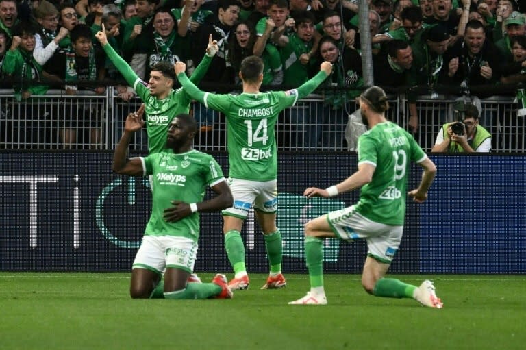 Saint-Etienne players celebrate during the French L1-L2 play-off match against <a class="link " href="https://sports.yahoo.com/soccer/teams/metz/" data-i13n="sec:content-canvas;subsec:anchor_text;elm:context_link" data-ylk="slk:Metz;sec:content-canvas;subsec:anchor_text;elm:context_link;itc:0">Metz</a> (JEAN-PHILIPPE KSIAZEK)