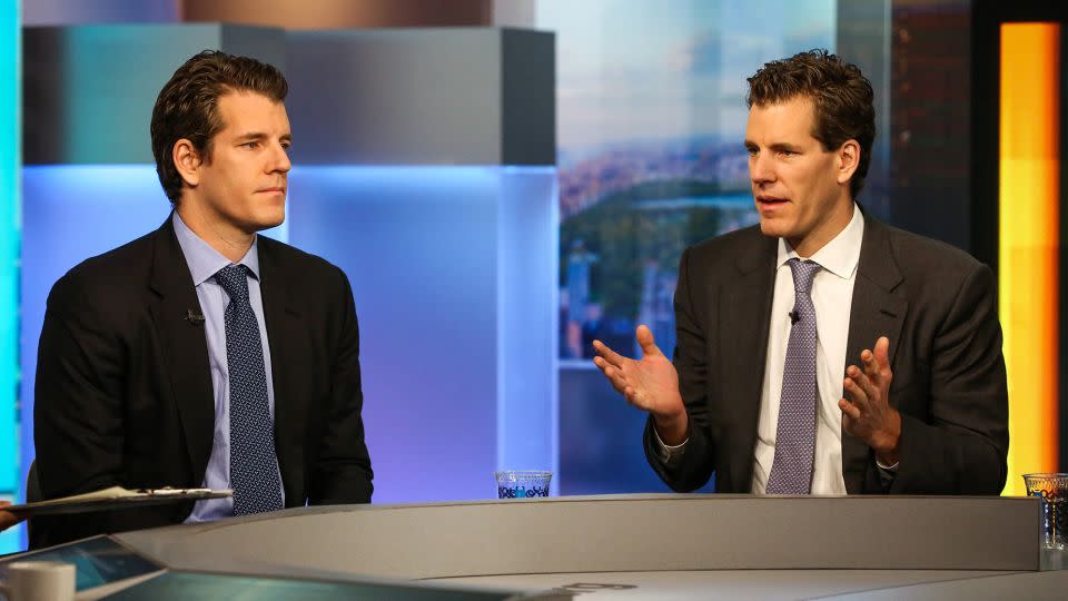 Tyler Winklevoss, left, co-founded Gemini Trust with his twin brother, Cameron Winklevoss, right. - Christopher Goodney/Bloomberg/Getty Images