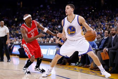 Jan 21, 2015; Oakland, CA, USA; Golden State Warriors guard Klay Thompson (11) prepares to shoot the ball in front of Houston Rockets guard Jason Terry (31) during the fourth quarter at Oracle Arena. The Warriors won 126-113. Mandatory Credit: Kelley L Cox-USA TODAY Sports