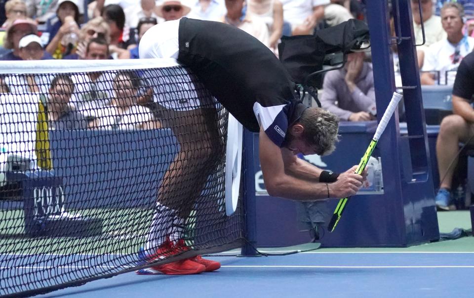 Benoit Paire of France got smacked with his own tennis racket after he smashed it to the ground in anger. (Getty Images)