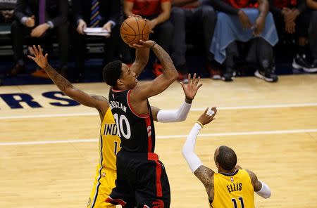 Apr 21, 2016; Indianapolis, IN, USA; Toronto Raptors forward DeMar DeRozan (10) takes a shot against Indiana Pacers guard Monta Ellis (11) in the first quarter in game three of the first round of the 2016 NBA Playoffs at Bankers Life Fieldhouse. Brian Spurlock-USA TODAY Sports