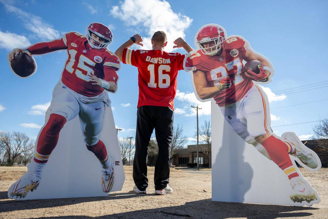 Philip Rineberg, a Kansas City Chiefs fan, proudly displays his Len Dawson jersey as he poses for a photo in Guymon, Okla.
