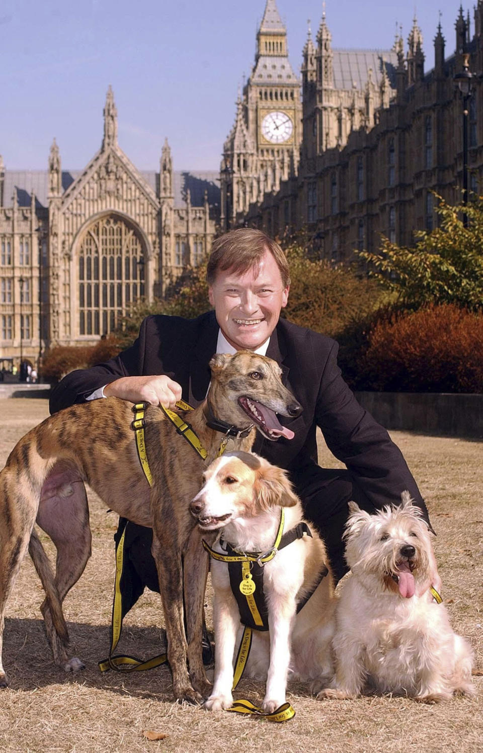 Conservative lawmaker David Amess outside the Houses of Parliament in Westminster, London on Sept. 17, 2003. British police say a man has been arrested after a reported stabbing in eastern England. News outlets say the victim is Conservative lawmaker David Amess. The Essex Police force said officers were called to reports of a stabbing in Leigh-on-Sea just after noon Friday. It said “a man was arrested shortly after & we’re not looking for anyone else.” (John Stillwell/PA via AP)