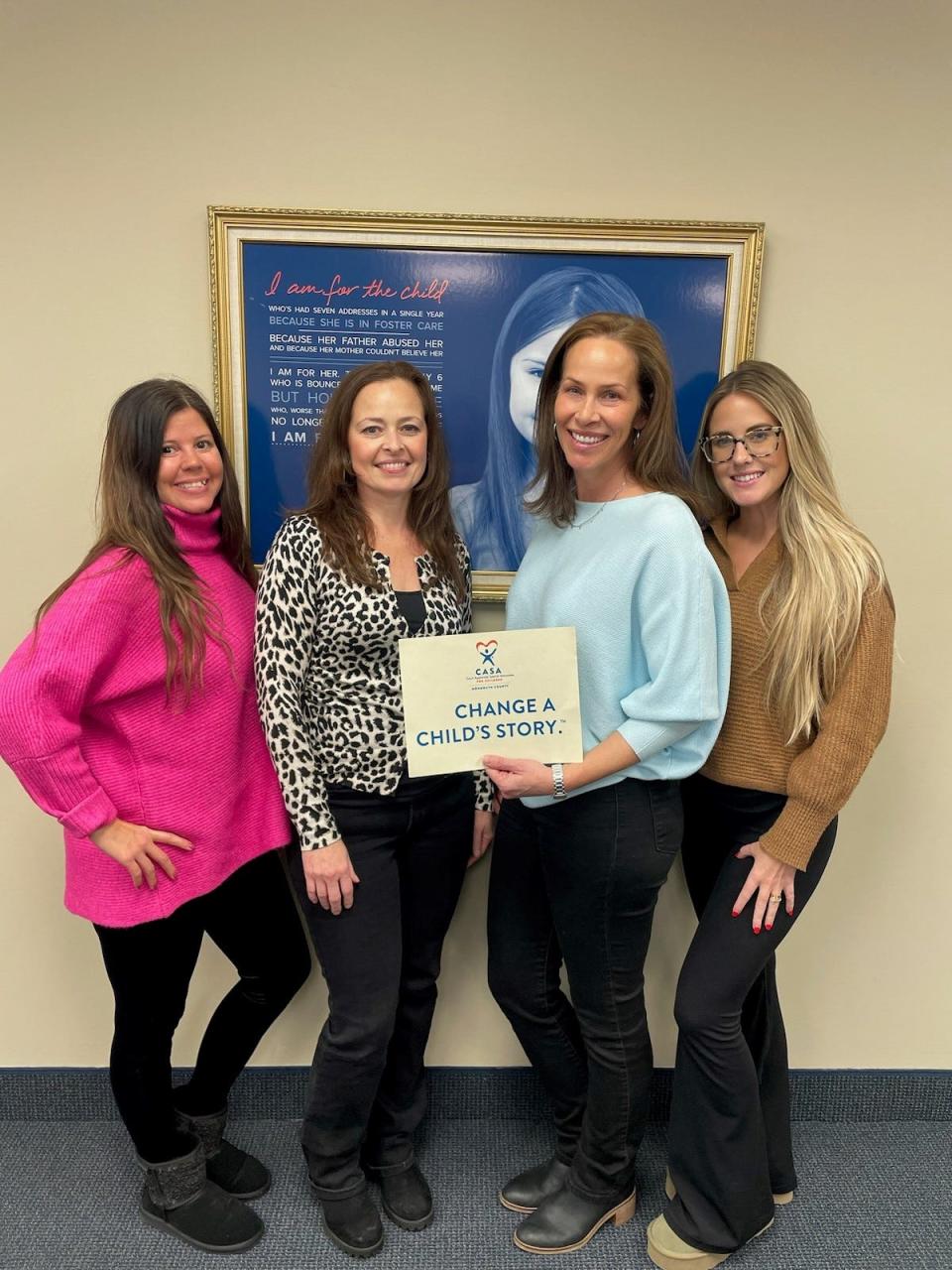 At CASA for Children of Monmouth County headquarters in Ocean Township: Volunteer advocate Alex Skove (second from right) with staff members Monica Davidson (far left), Renee Gregory (second from left) and Jill Clancy (far right).