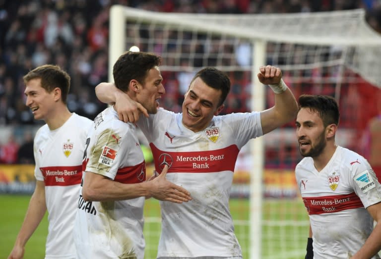 Stuttgart's (L-R) Daniel Schwaab, Christian Gentner, Filip Kostic and Lukas Rupp celebrate after the 2-0 goal during the Bundesliga match against Hertha Berlin in Stuttgart, on February 13, 2016