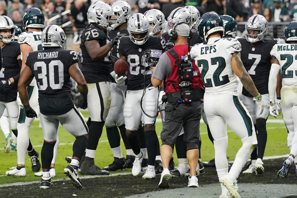 Las Vegas Raiders wide receiver Bryan Edwards (89) holds the ball after scoring a touchdown against the Philadelphia Eagles during the second half of an NFL football game, Sunday, Oct. 24, 2021, in Las Vegas. (AP Photo/Rick Scuteri)