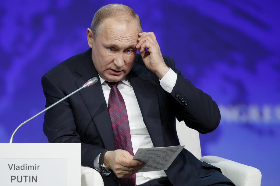 Russian President Vladimir Putin gestures while speaking at a plenary session of the International Arctic Forum in St. Petersburg, Russia, Tuesday, April 9, 2019. (AP Photo/Dmitri Lovetsky)