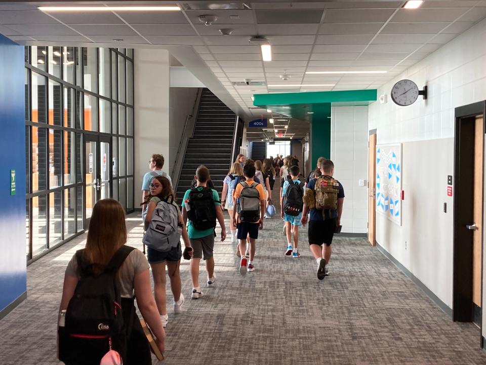 A group of students walks down a hallway inside Trailridge School on the first day of school in Waukee, on Wednesday, Aug. 23, 2023. The new school currently serves about 450 sixth and seventh grade students.