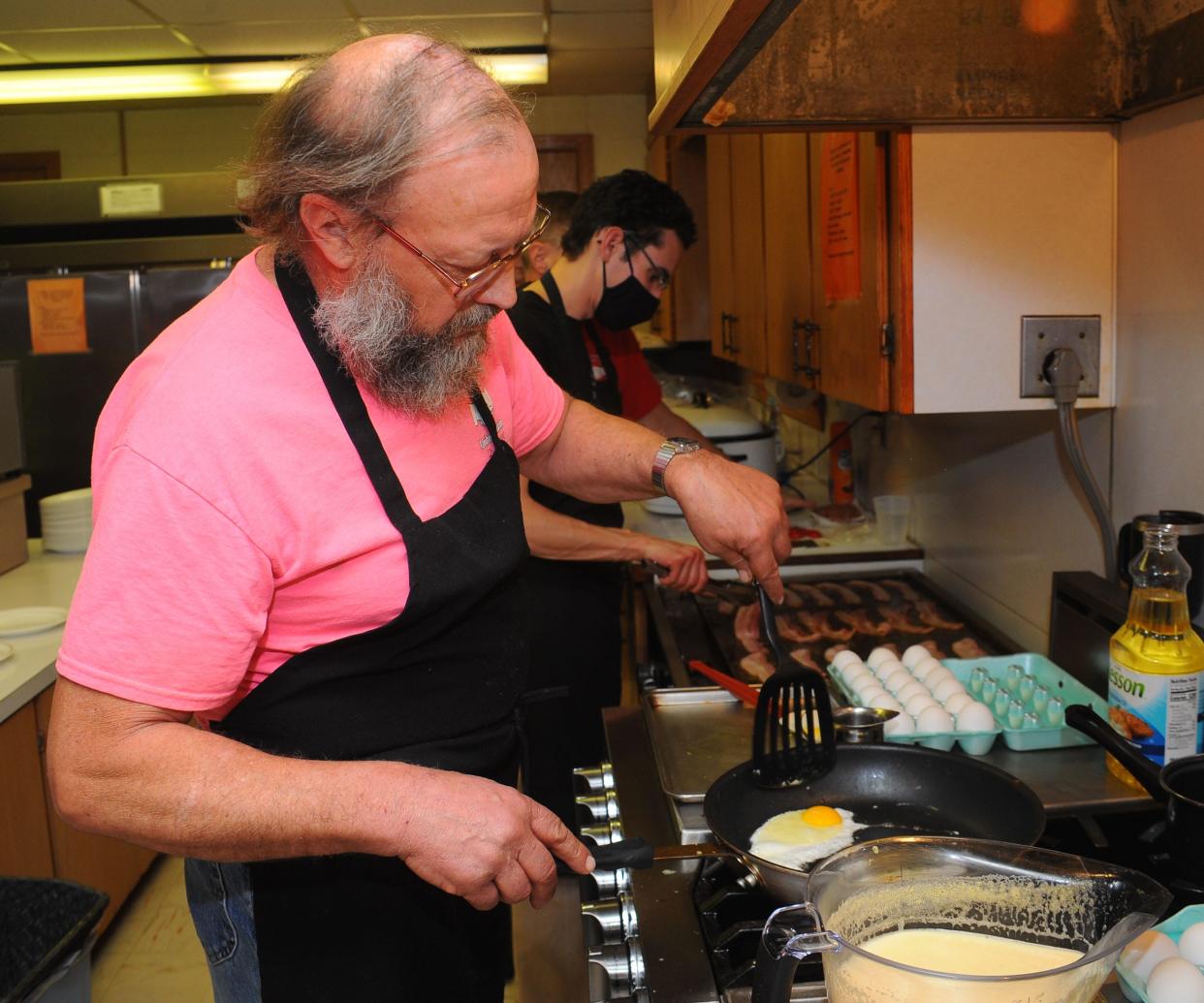 Ed Lydic cooks eggs Saturday, Jan. 15, 2022, during the monthly breakfast at Damascus United Methodist Church. The church accepts donations for the breakfast to sponsor a Summer 2022 mission trip. The trip will assist Jackson Area Ministries in Jackson, Ohio.