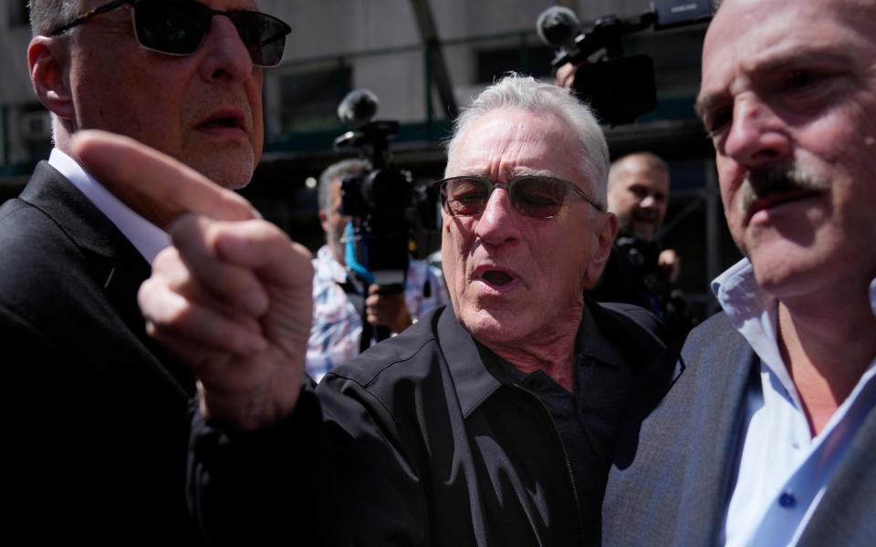 Actor Robert De Niro argues with a Donald Trump supporter after speaking to reporters in support of President Joe Biden across the street from Trump's criminal trial in New York