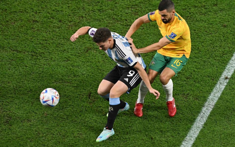 Argentina's forward #09 Julian Alvarez fights for the ball with Australia's defender #16 Aziz Behich during the Qatar 2022 World Cup round of 16 football match between Argentina and Australia at the Ahmad Bin Ali Stadium - AFP