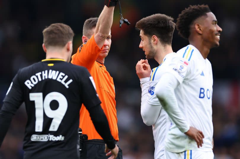 Junior Firpo of Leeds United receives a yellow card during the Championship match between Leeds United and Southampton FC at Elland Road -Credit:Robbie Jay Barratt - AMA/Getty Images