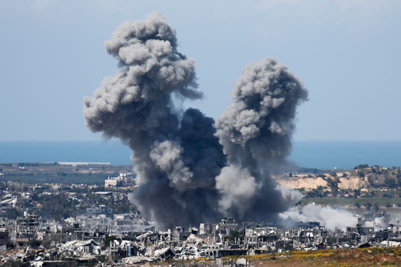 Smoke rises from Gaza during an explosion following an airstrike, as seen from Israel