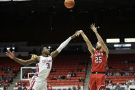 Utah guard Rollie Worster (25) shoots while defended by Washington State guard Kymany Houinsou (31) during the second half of an NCAA college basketball game, Sunday, Dec. 4, 2022, in Pullman, Wash. Utah won 67-65. (AP Photo/Young Kwak)