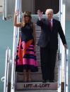 <p>FLOTUS opted for a bold, brightly colored dress by Delpozo while visiting Poland. The ankle-length, sleeveless dress was solid navy at the top with hot pink designs on the skirt.</p>
