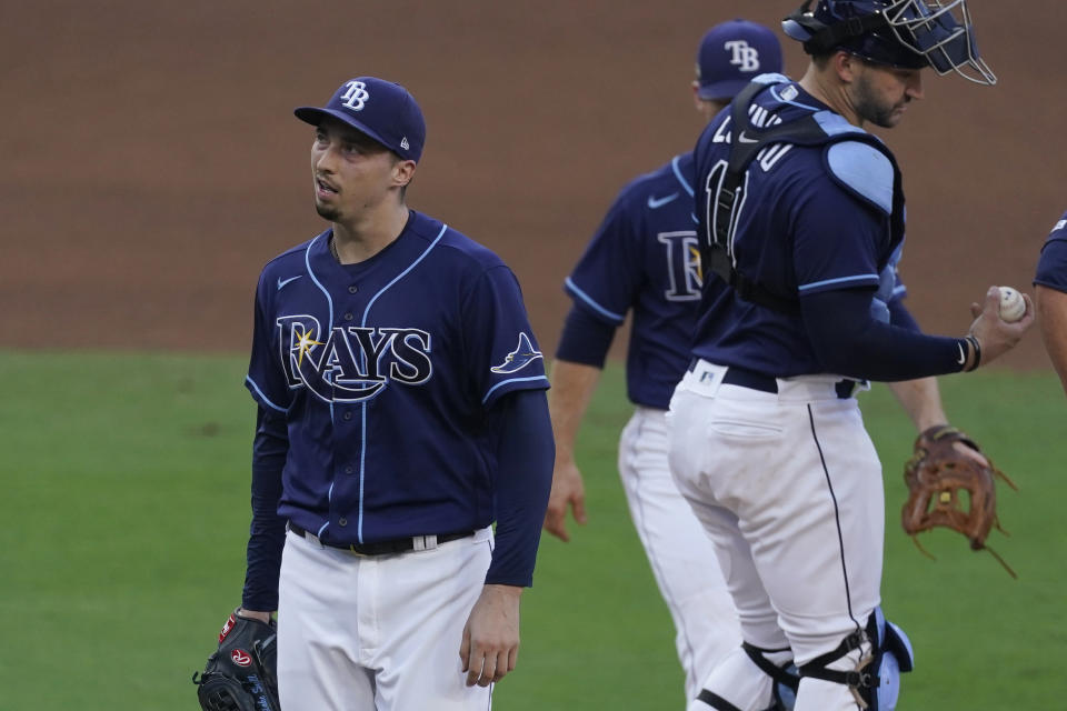 Tampa Bay Rays pitcher Blake Snell walks off the mound after being relieved during the fifth inning in Game 6 of a baseball American League Championship Series, Friday, Oct. 16, 2020, in San Diego. (AP Photo/Ashley Landis)