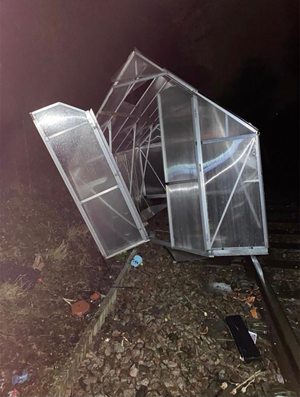 A greenhouse thrown around in Storm Isha winds landed on a rail line (Network Rail Kent & Sussex @NetworkRailSE/Twitter)