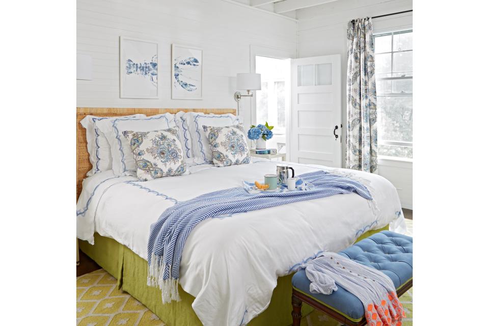 <p>The homeowners wanted the master bedroom to feel like a serene sanctuary. White walls with accents of lapis and yellow-green make the space fresh and inviting.</p>