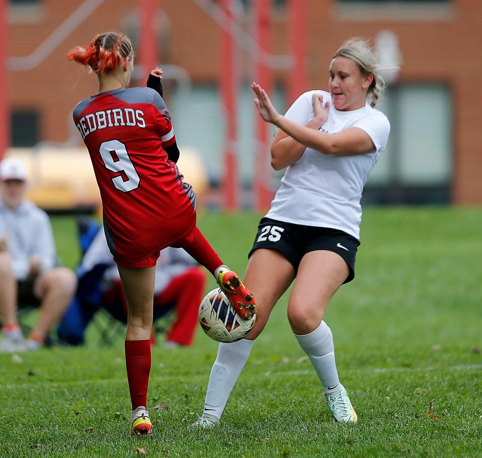 Loudonville High School's Brynn Bailey (9) and Northwestern High School's Carissa Brinker (25) battle for control of the ball during high school girls soccer action in Loudonville Thursday, Sept. 29, 2022. TOM E. PUSKAR/ASHLAND TIMES-GAZETTE