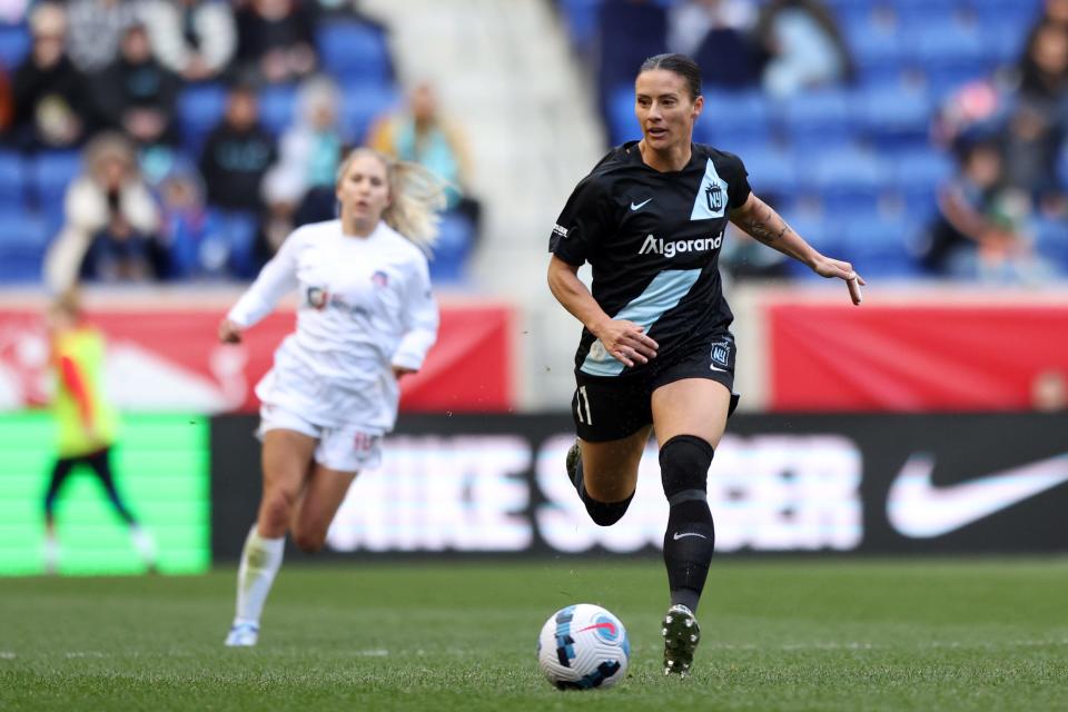 Ali Krieger runs on the ball during her first season with Gotham FC.