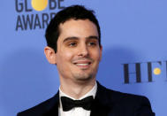 FILE PHOTO: Director Damien Chazelle after winning Best Screenplay - Motion Picture for "La La Land" during the 74th Annual Golden Globe Awards in Beverly Hills, California, U.S., January 8, 2017. REUTERS/Mario Anzuoni/ File Photo