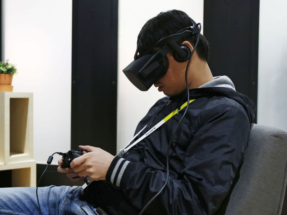 A man uses the Oculus Rift at CES in Las Vegas: John Locher/AP