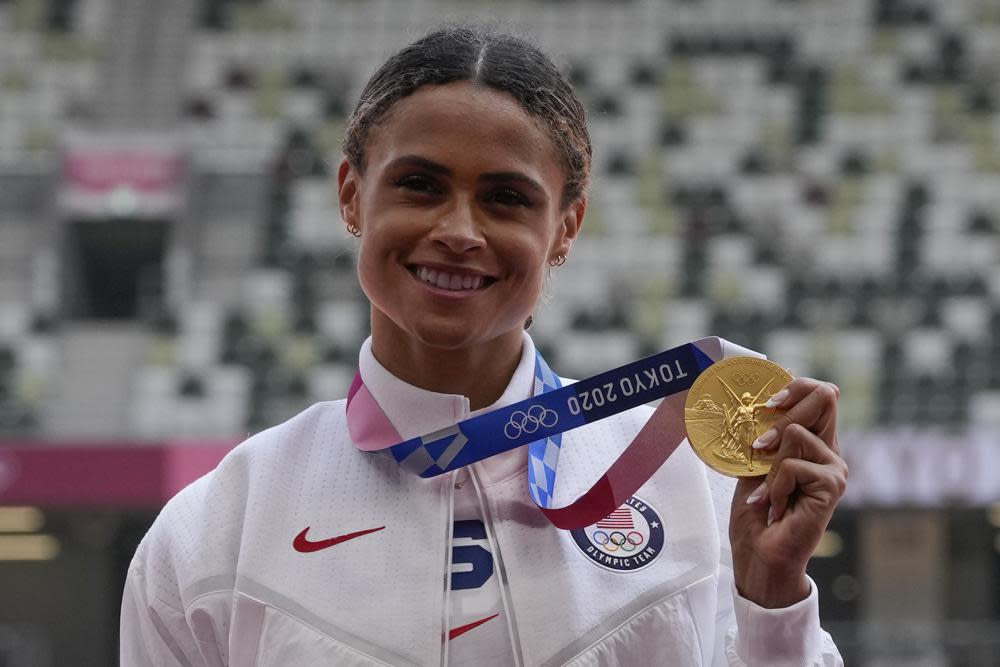 Gold medalist Sydney McLaughlin, of the United States, poses during the medal ceremony for the women’s 400-meter hurdles at the 2020 Summer Olympics, Wednesday, Aug. 4, 2021, in Tokyo. (AP Photo/Francisco Seco)
