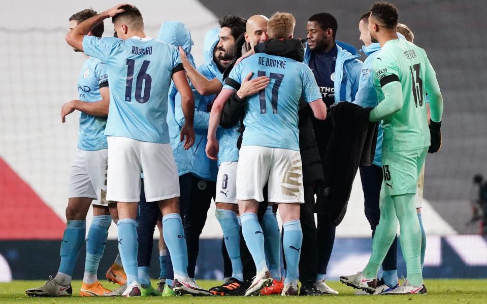 Pep Guardiola, manager of Manchester City celebrates with Kevin de Bruyne during the Carabao Cup Semi Final match between Manchester United and Manchester City - GETTY IMAGES