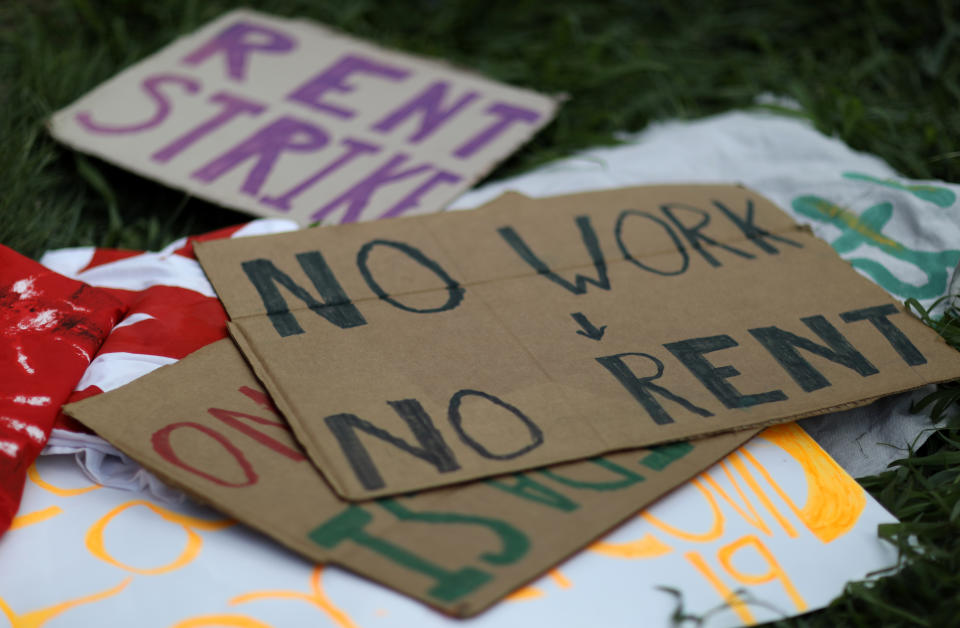 Signs lay on the ground after people gathered outside of an apartment complex with the intention to stop the alleged eviction of one of the tenants in Mount Rainier, MD, U.S., August 10, 2020. (Leah Millis/Reuters)